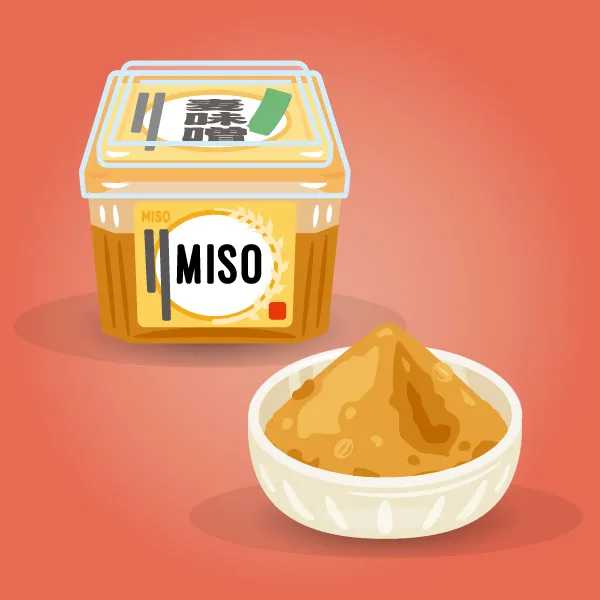 Un petit bol de pâte de miso et son contenant.