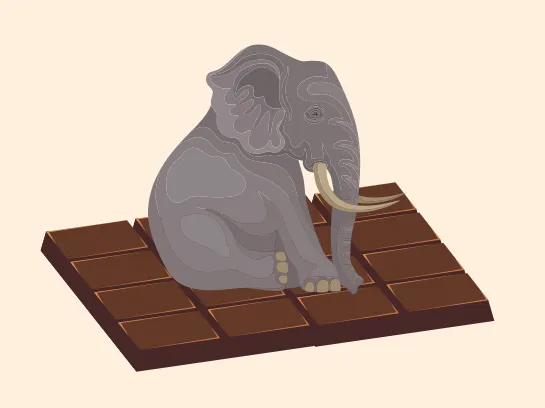 Un éléphant gris assis sur une énorme palette de chocolat.