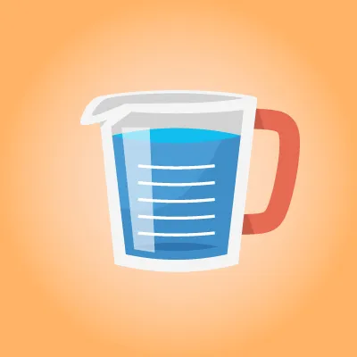 Une tasse à mesurer remplie de liquide.