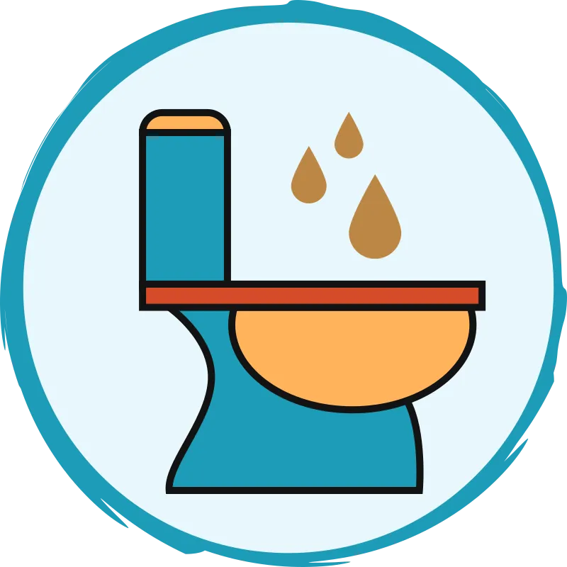 Trois gouttes de couleur ocre au-dessus d’une toilette.